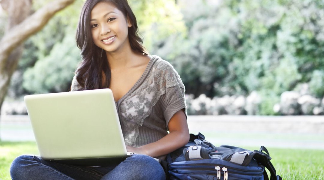 young-female-college-student-on-laptop